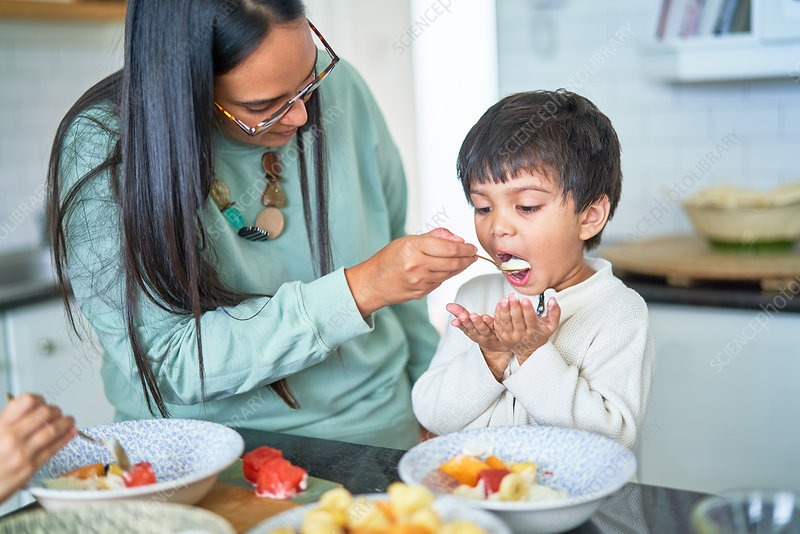 Mother feeding child
